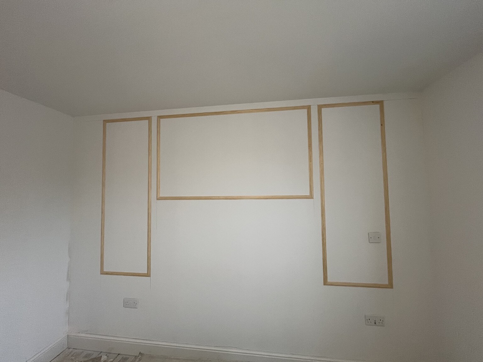 Wall marked out for a made-to-measure fitted storage unit
