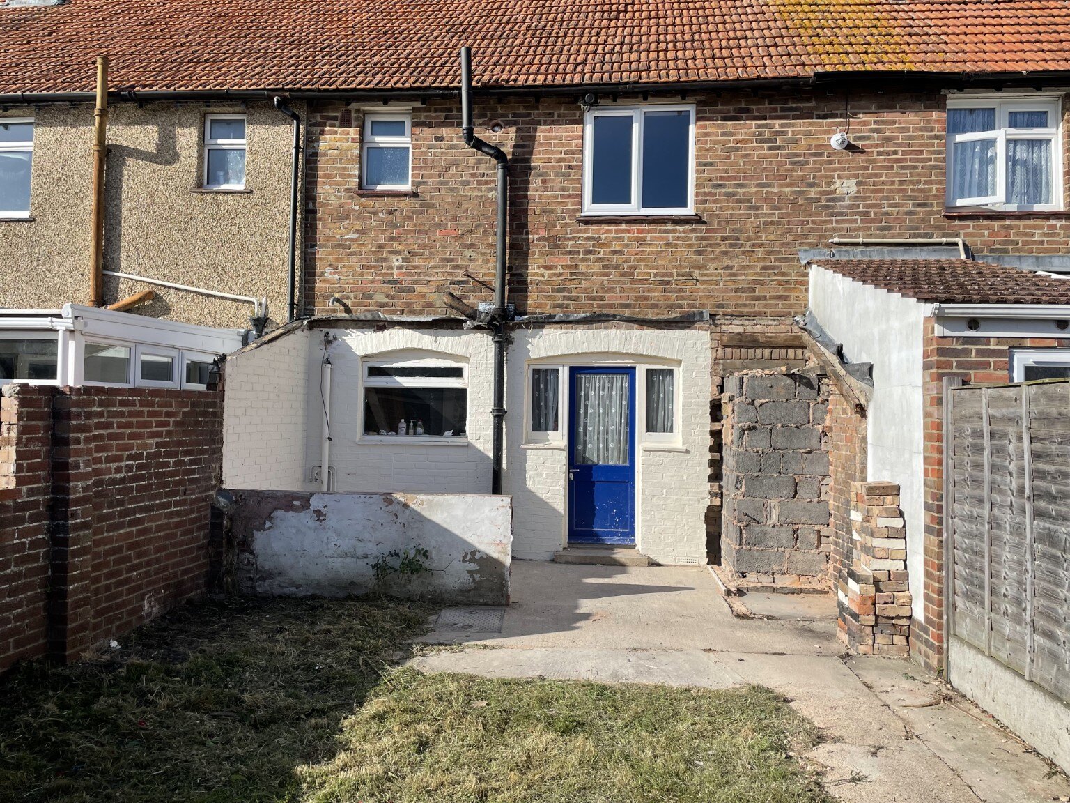Rear of the terraced property at the start of renovation with old structures removed