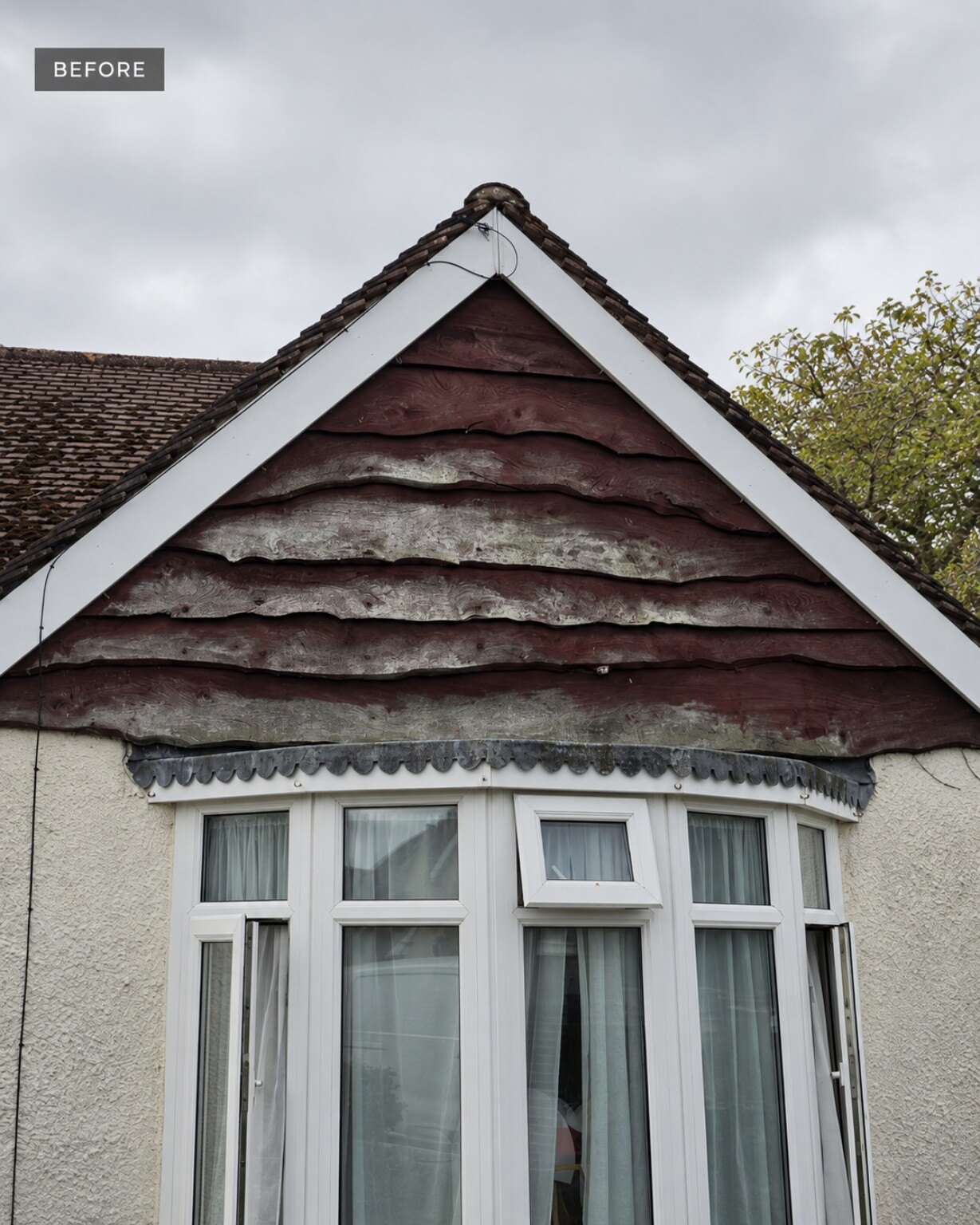 Weathered gable cladding before exterior carpentry work in Felpham