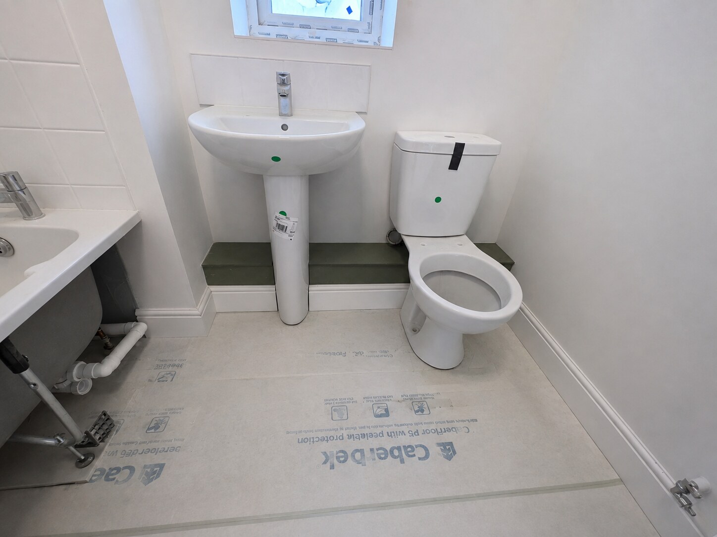 Skirting fitted around bathroom boxing and sanitaryware on a new-build project