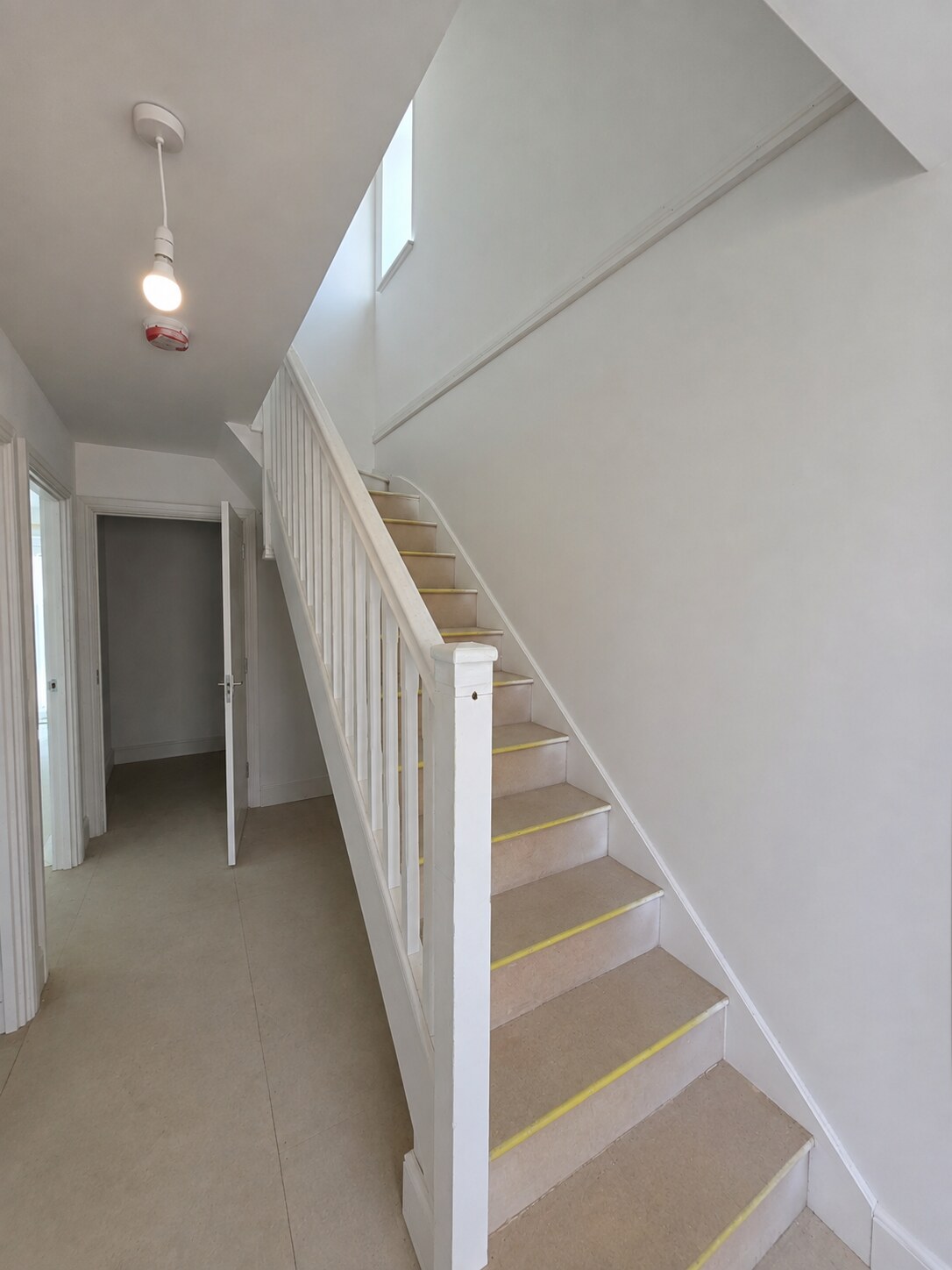 Detailed skirting junction around service boxing in a new-build home