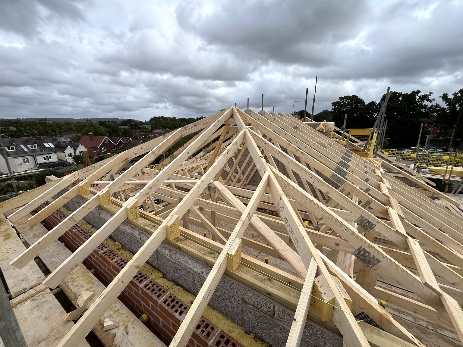 Pitched timber rafters under construction