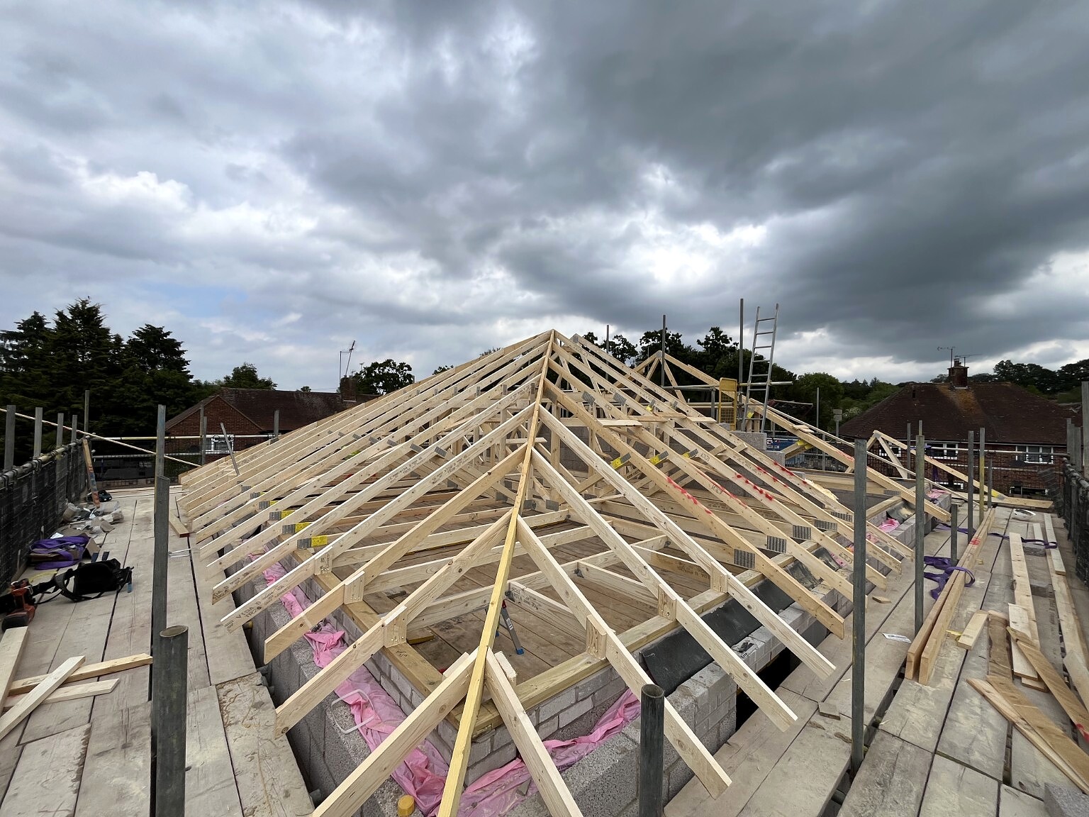 Multiple timber roofs under construction on a housing project