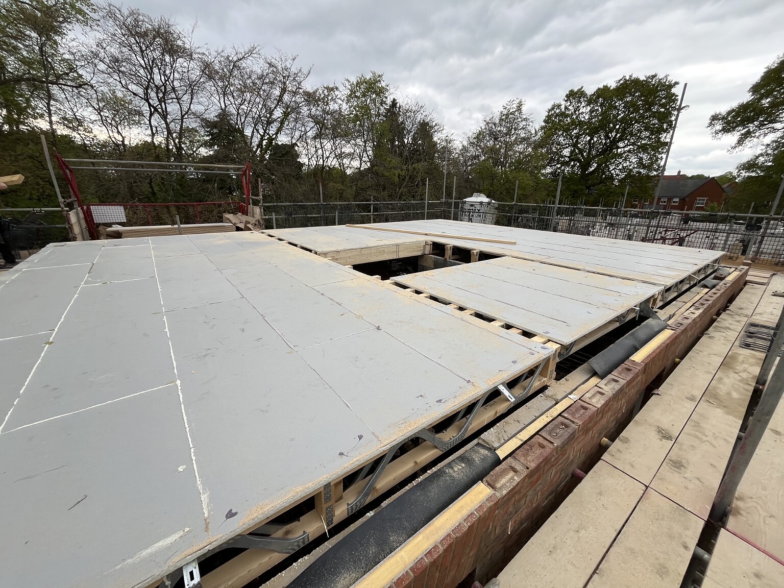 Structural deck boards fitted over a joist package
