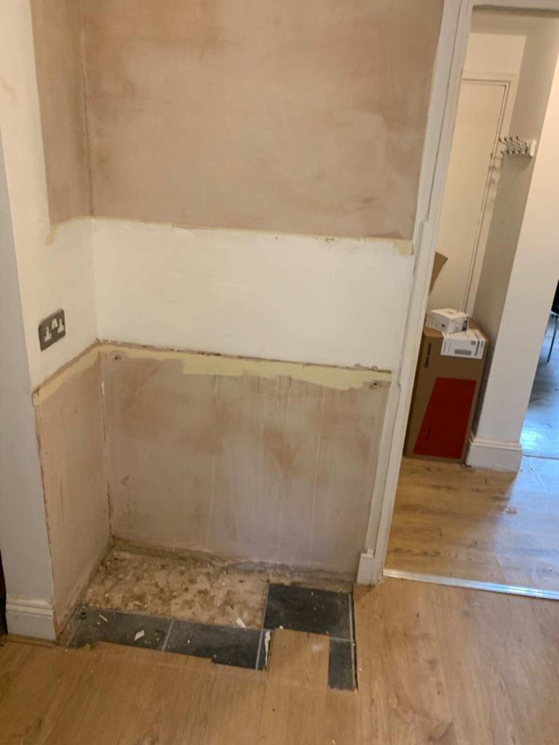 Stripped storage recess before new kitchen units were fitted in Pagham