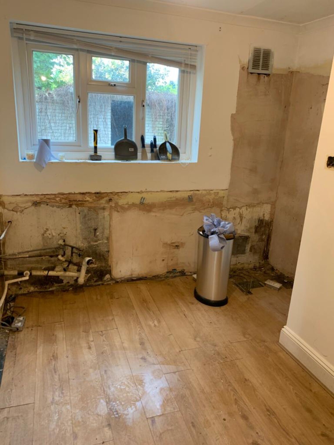 Stripped window wall before a kitchen refurbishment in Pagham