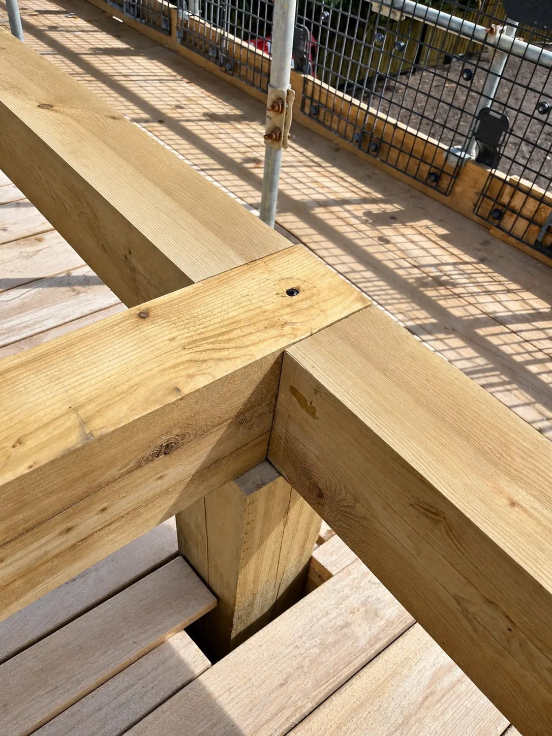 Close view of a structural timber junction during roof carpentry