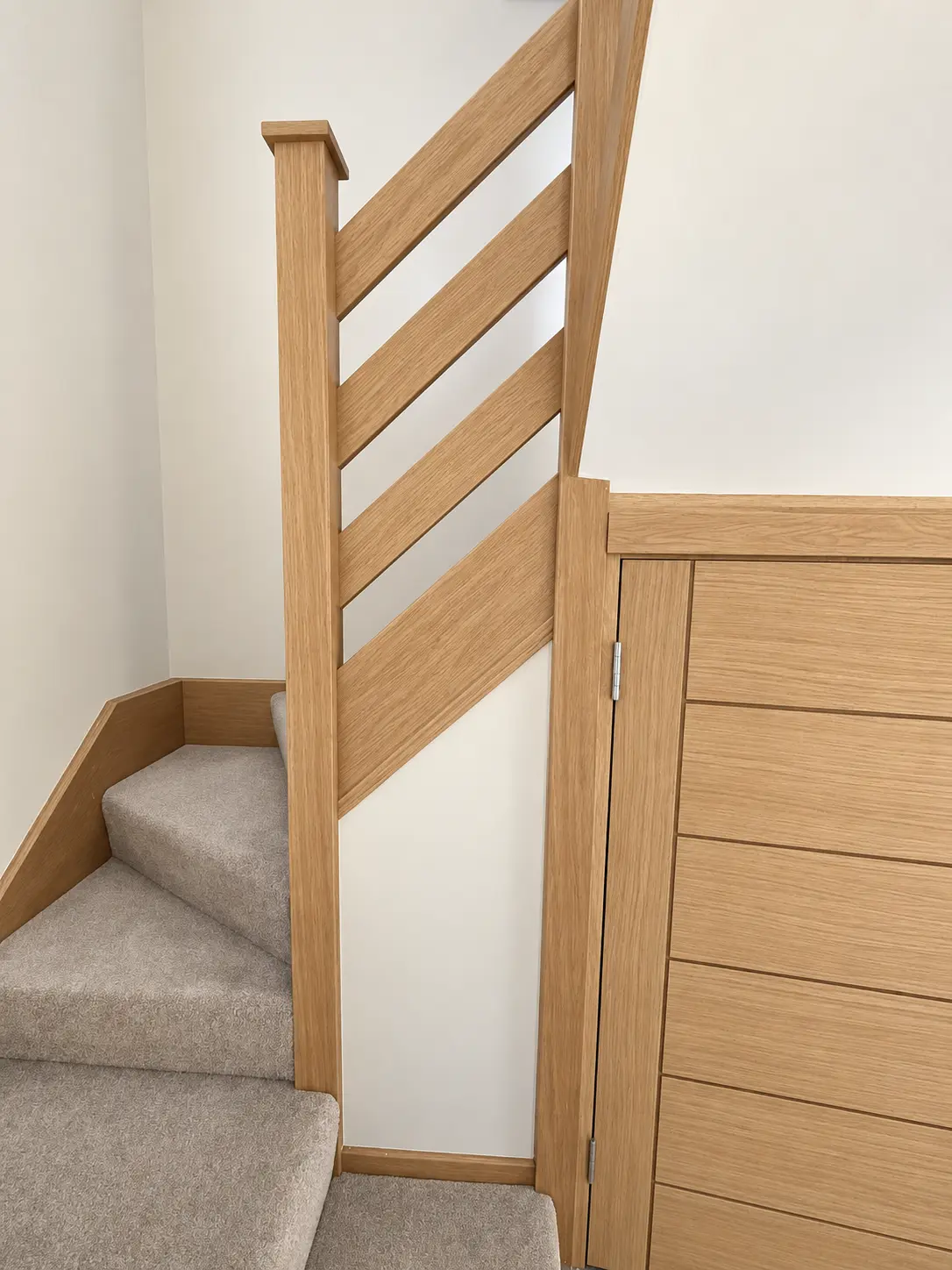 Light-oak treatment around the winder landing and adjacent joinery