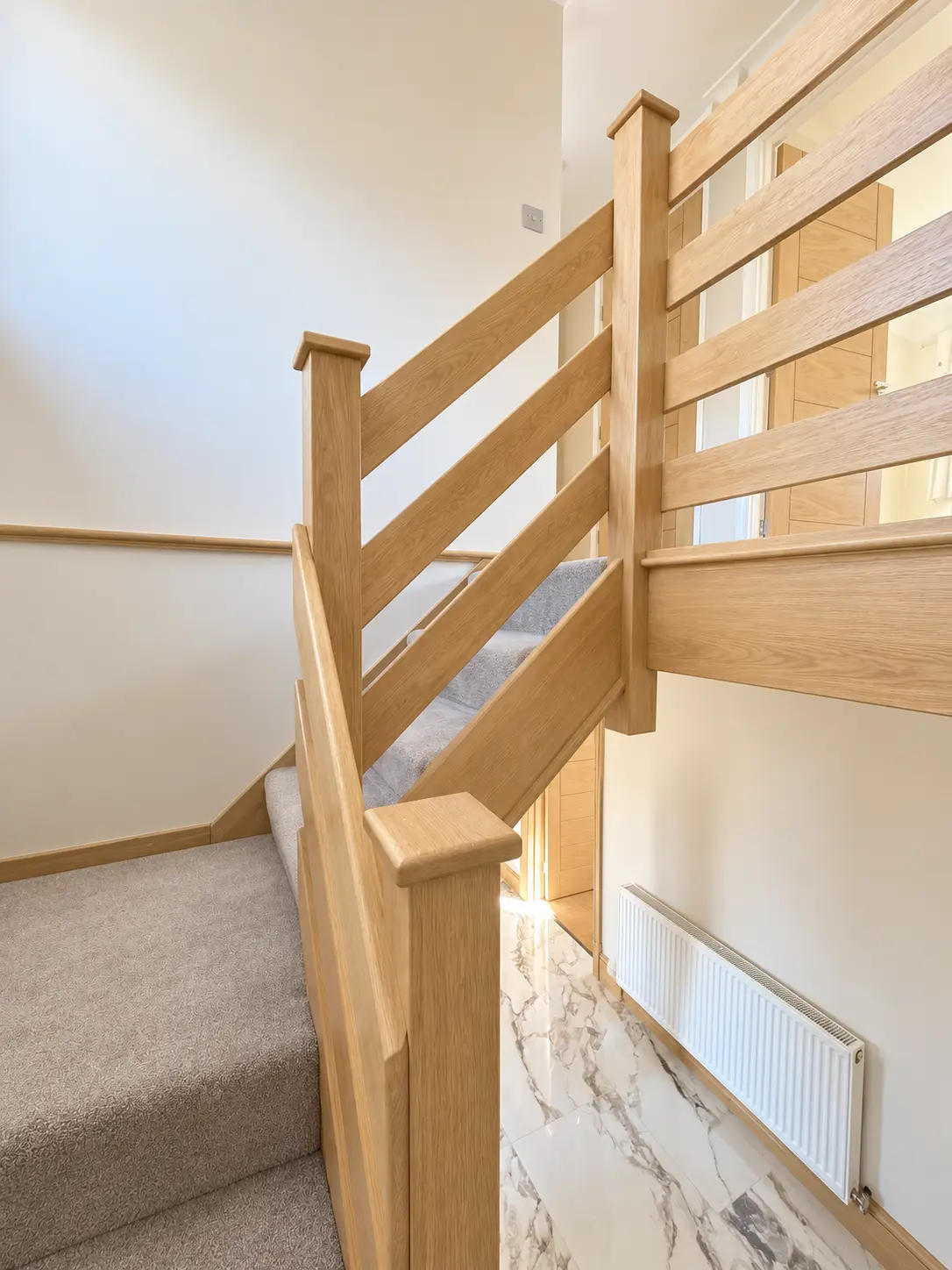 Light-oak upper landing and stair balustrade concept
