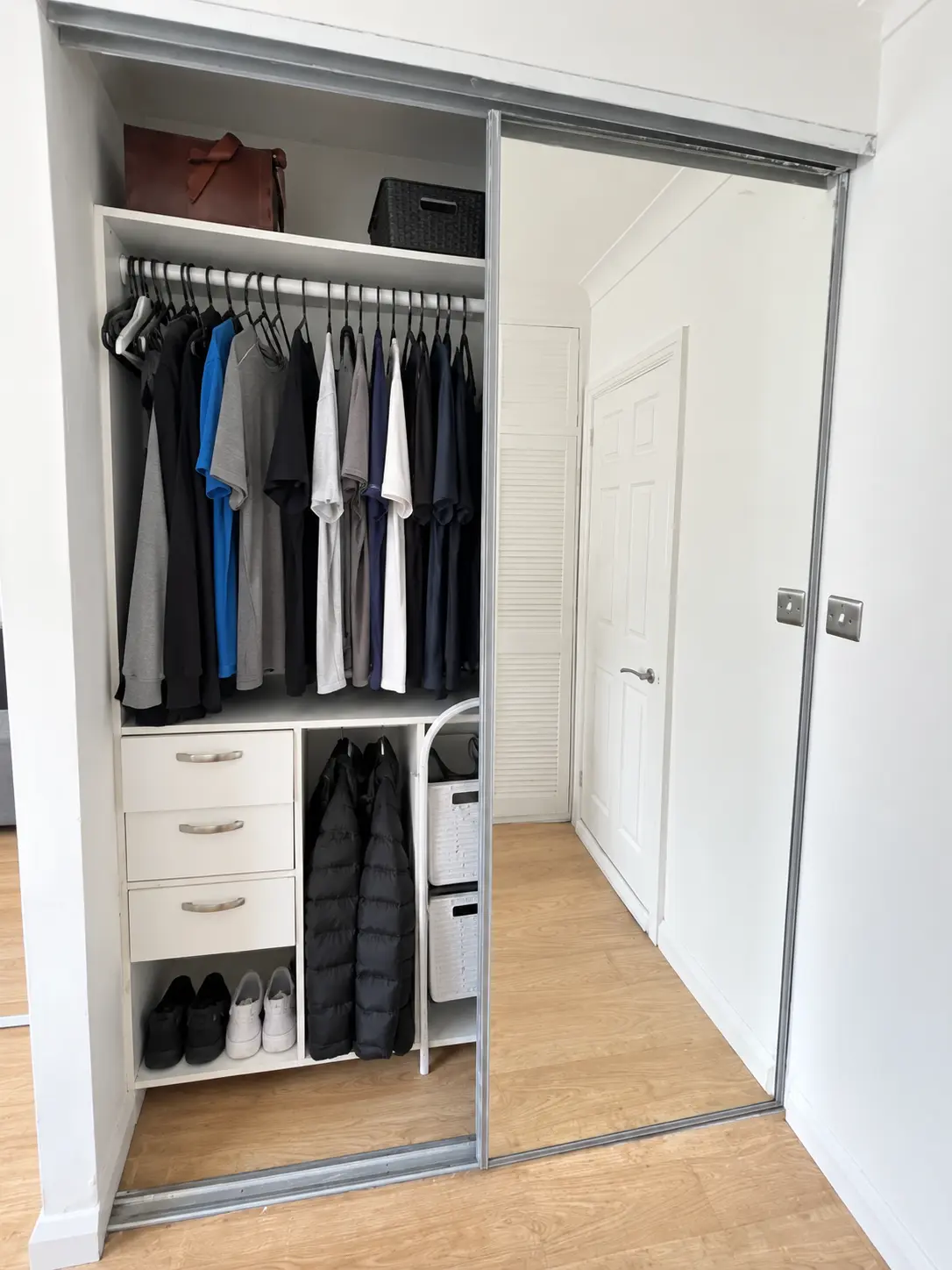 Existing mirrored sliding wardrobe before repair with original rail system