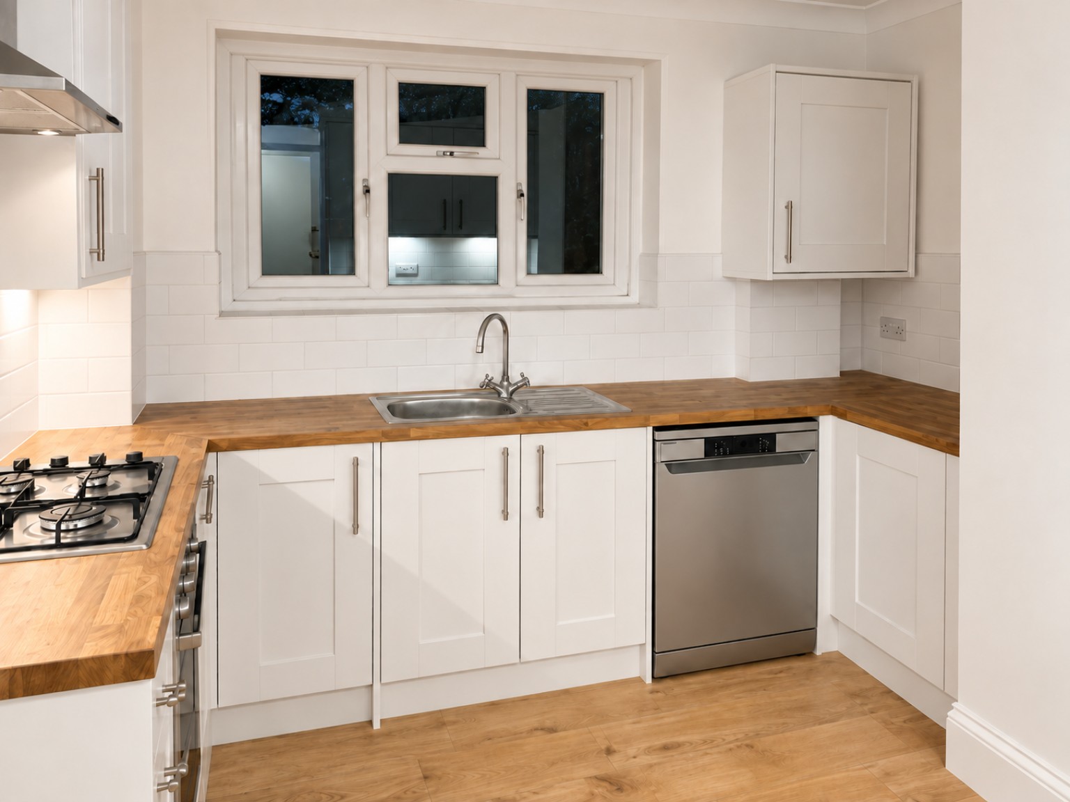 Finished white fitted kitchen completed by Sixes Carpentry in Pagham