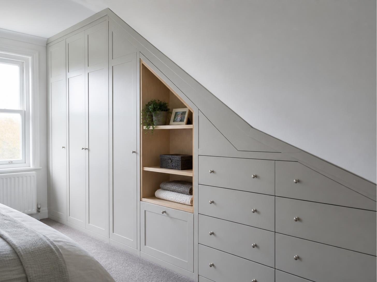 Illustrative fitted storage under a sloping ceiling