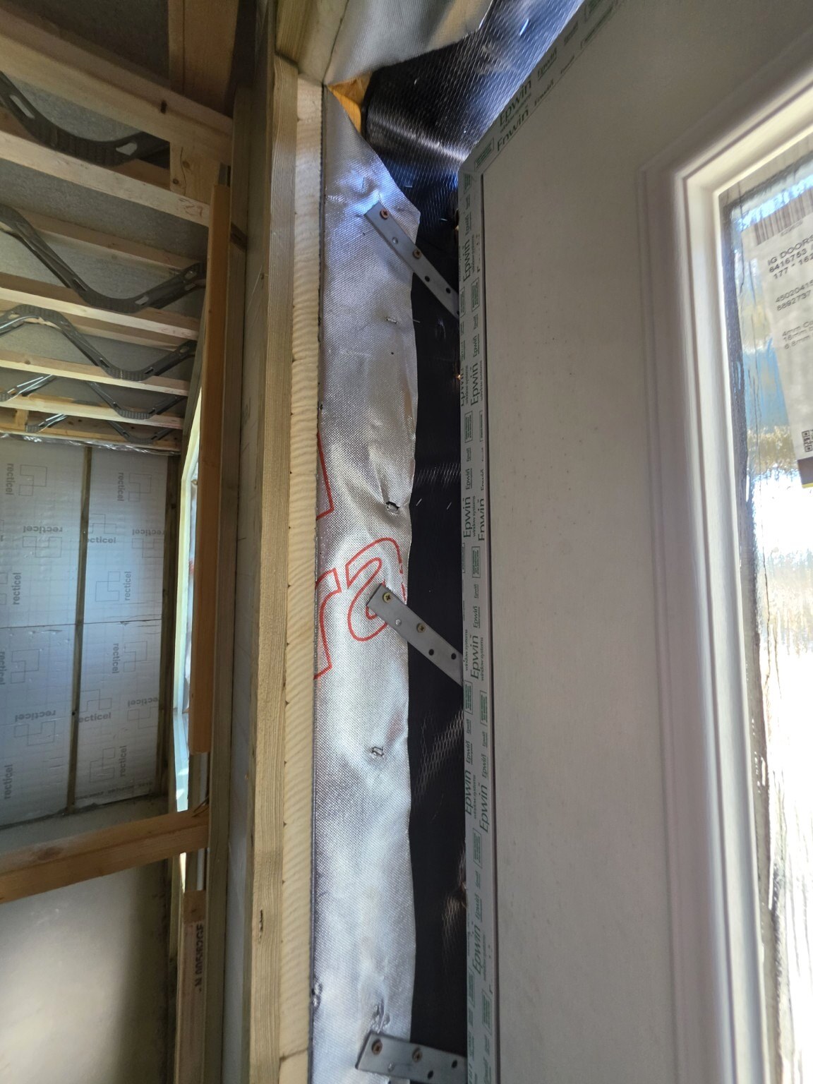 Metal fixing straps securing a front-door frame in Wick, Littlehampton