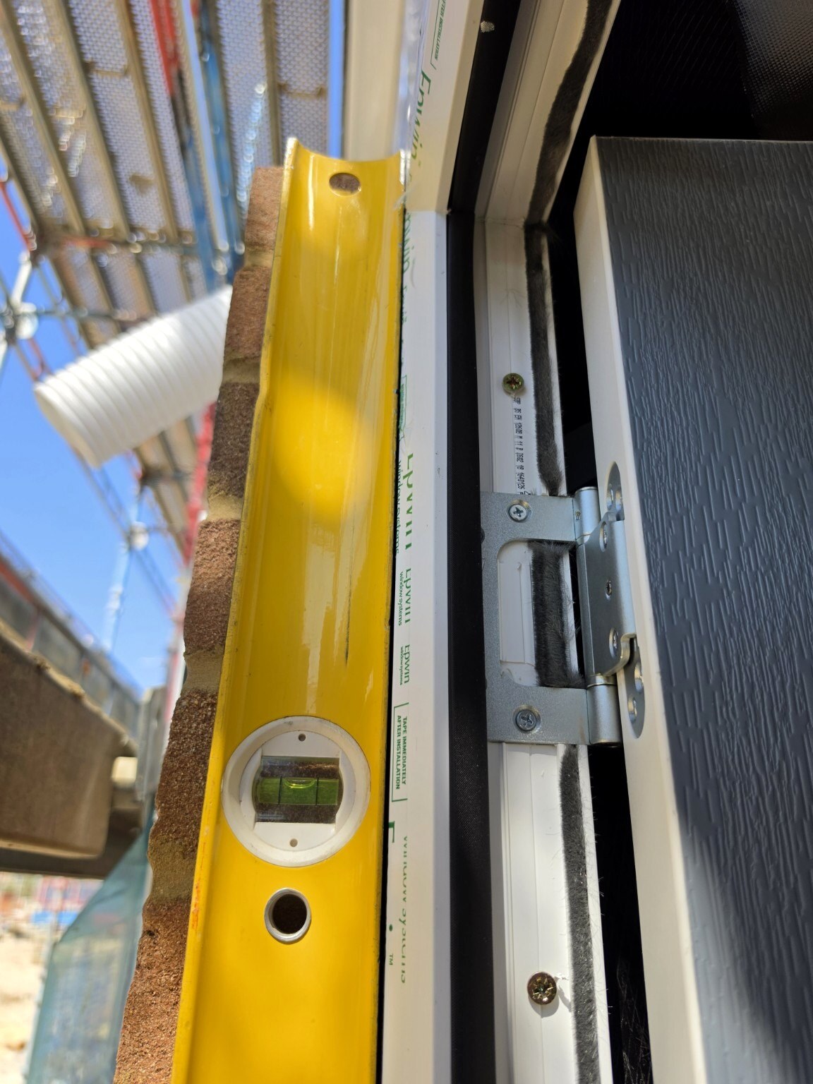 Front-door frame checked for plumb during installation in Wick, Littlehampton